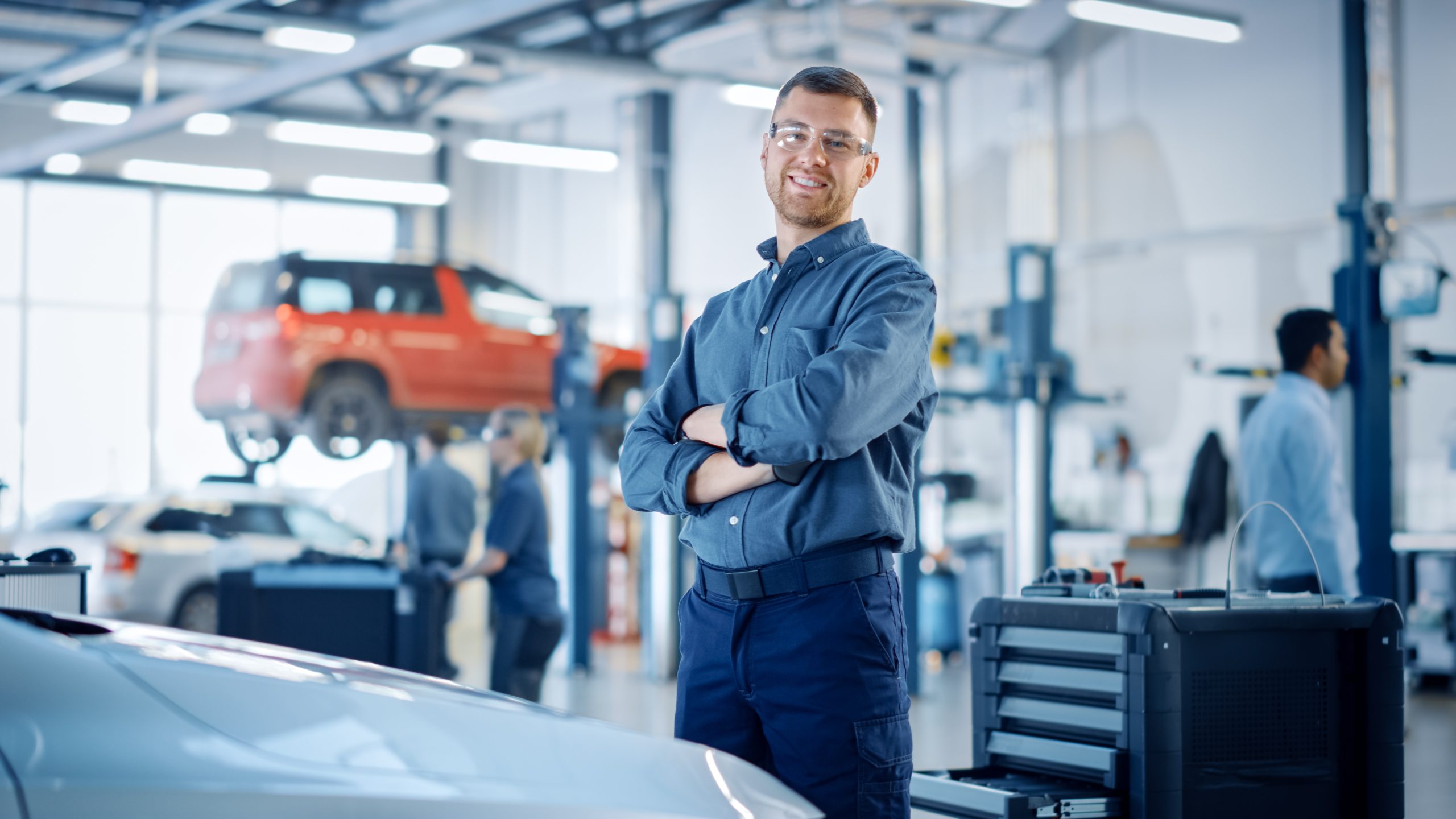 Technician standing in an automotive service center
